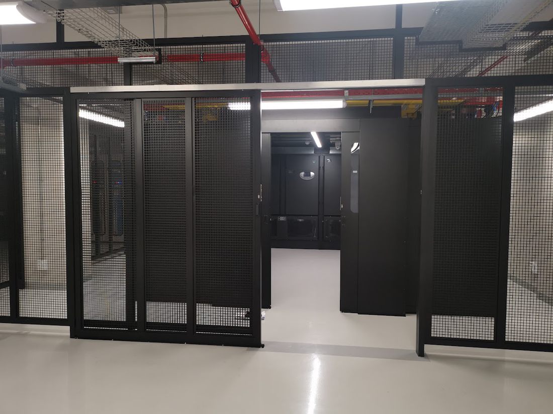 Caged rack suites inside a data centre hall